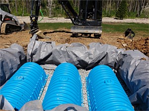 Underground water chamber to catch water from downspouts