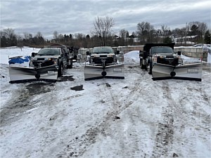 Plow trucks used for commercial snow removal