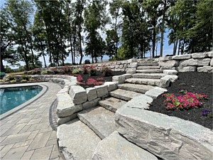 Boulder wall with steps, fresh landscape planting in Chester Springs